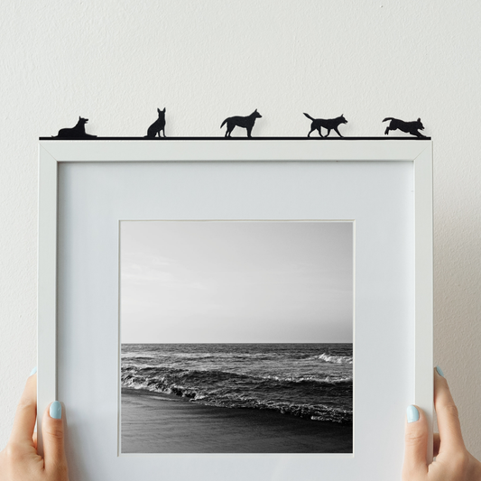 Australian Cattle dog ornament made from recycled plastic displayed on top of a picture frame