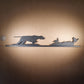 An English Pointer flushing grouse ornament made from recycled plastic pictured to display the products scale