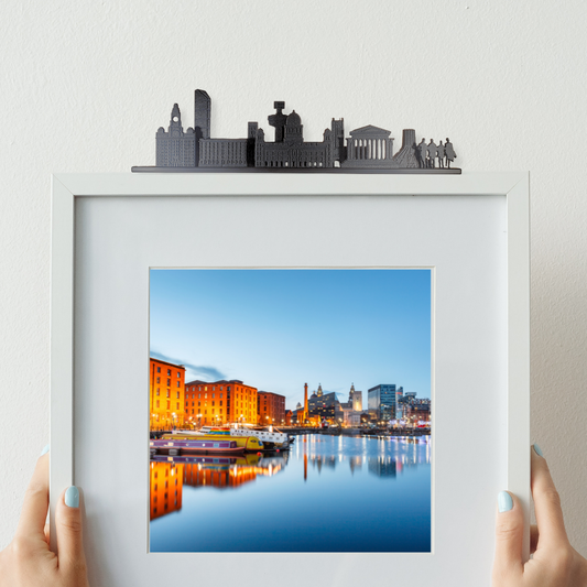 Liverpool skyline ornament made from recycled plastic displayed on top of a picture frame